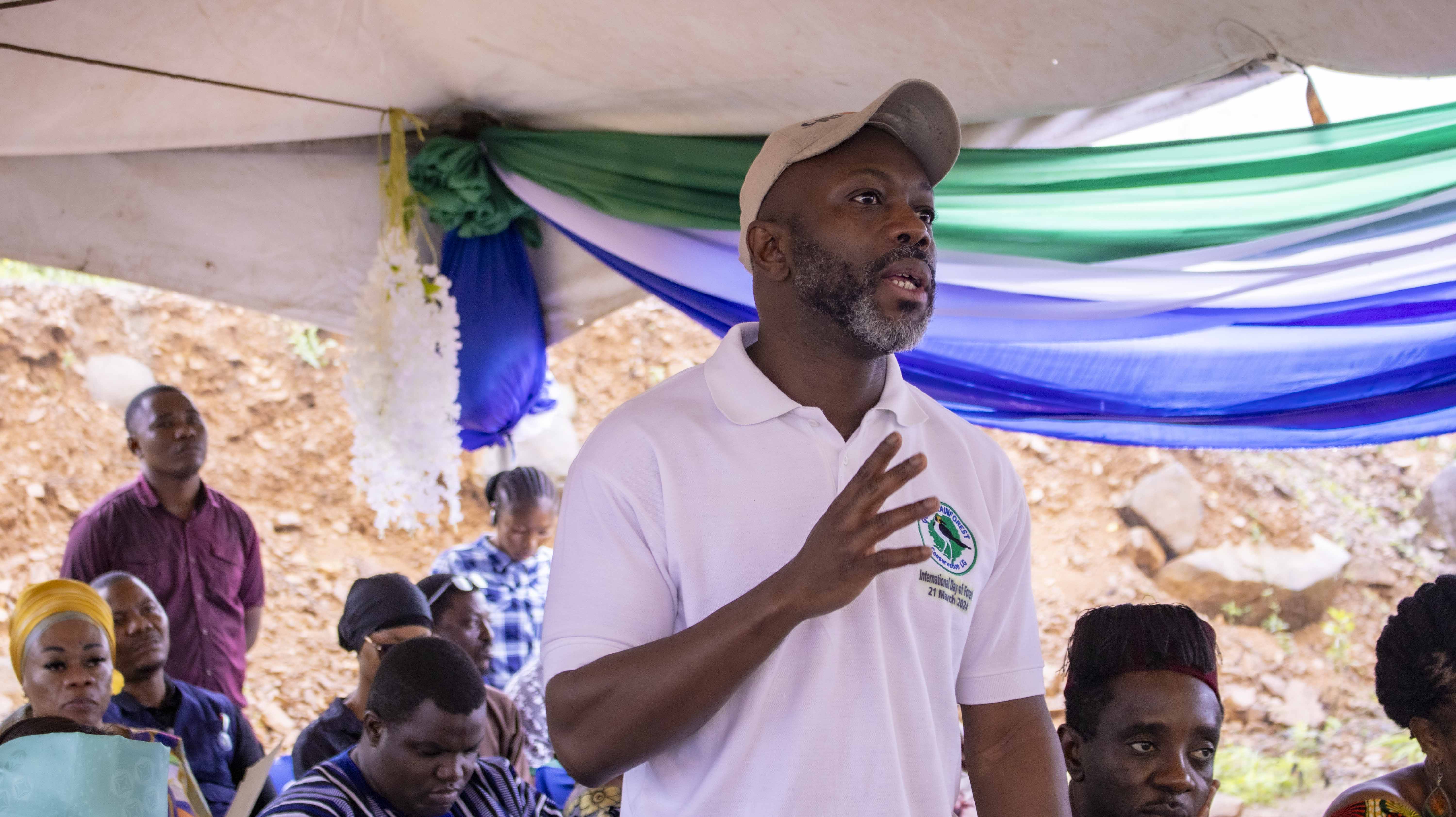 Jiwoh Abdulai, Minister of Environment and Climate Change a group of people around each other