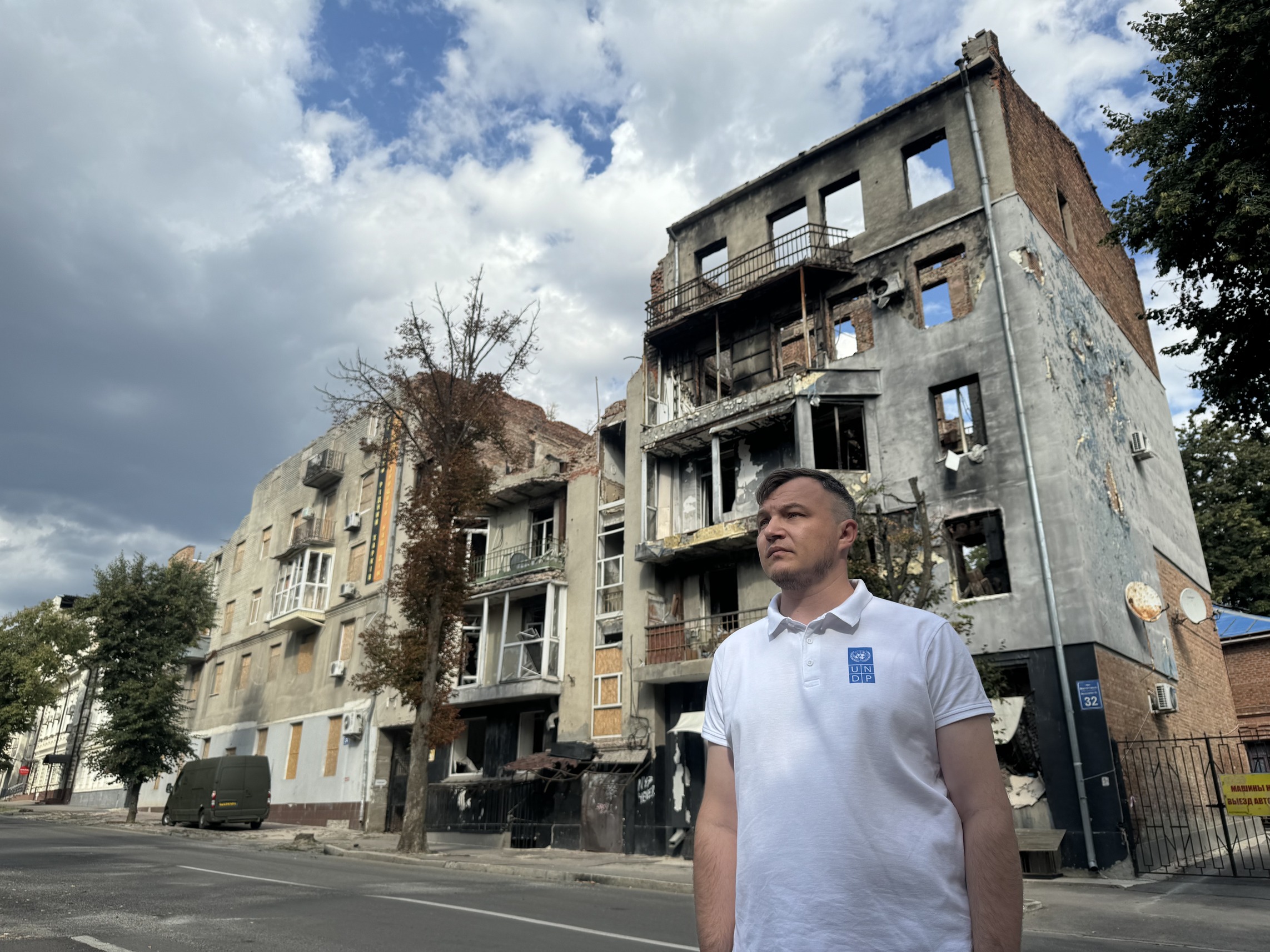 a man standing in front of a building