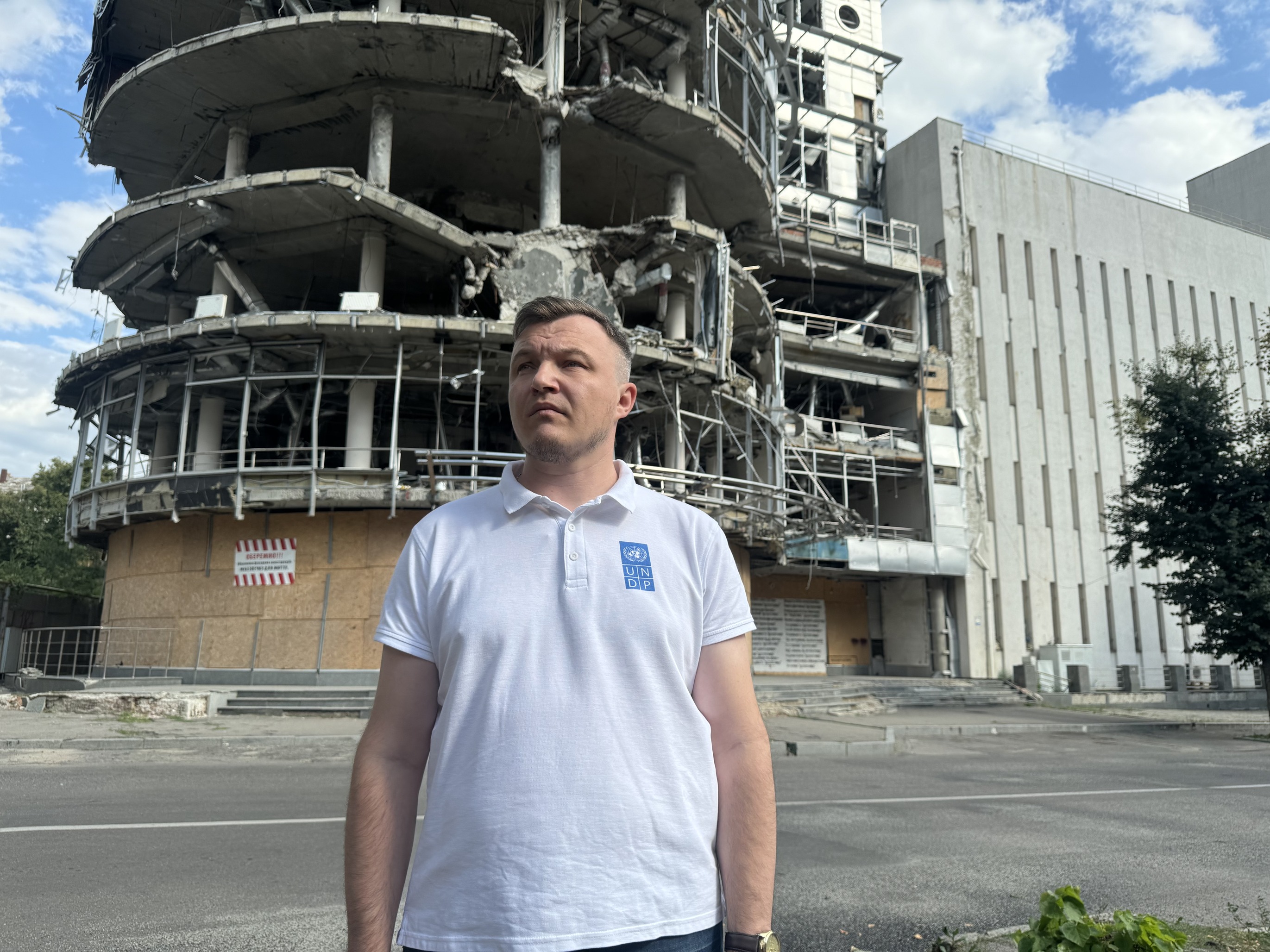 a man standing in front of a building